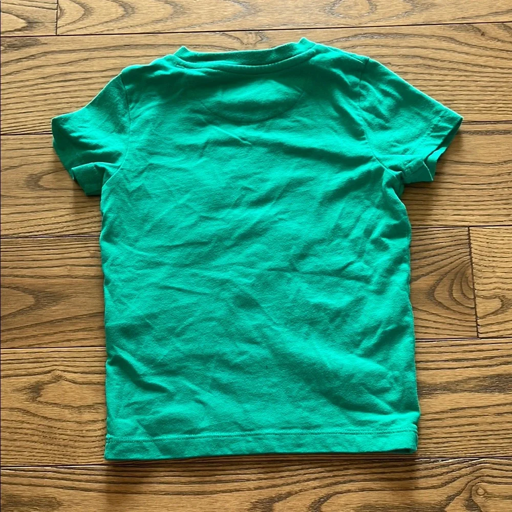 Vibrant Green Short Sleeve Tee with Playful Lion Design